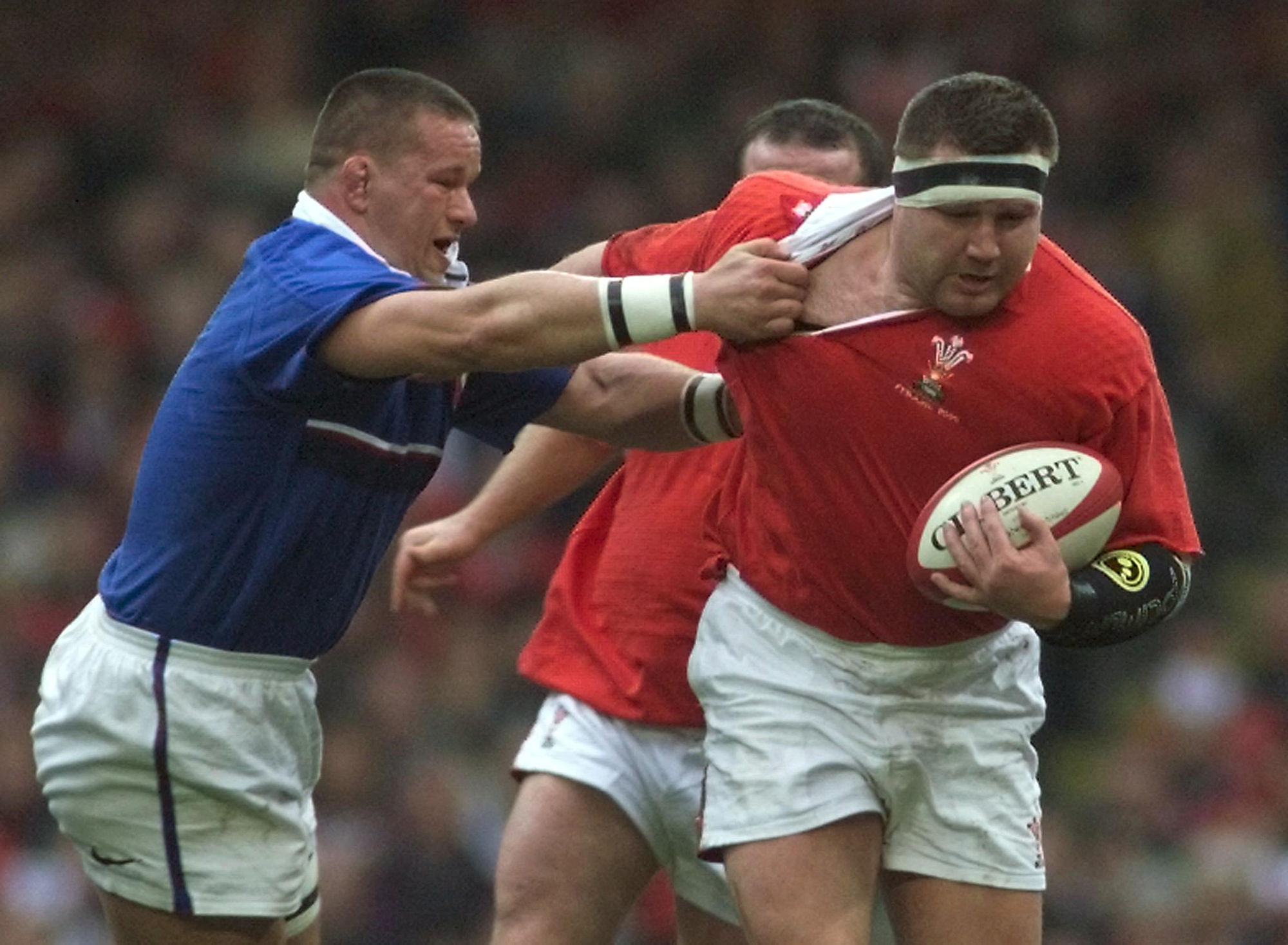 Wales' Dai Young charges at France's Christian Califano during the 2000 Six Nations.