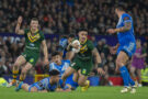 Australia's Valentine Holmes runs with the ball during the 2021 Rugby League World Cup final against Samoa