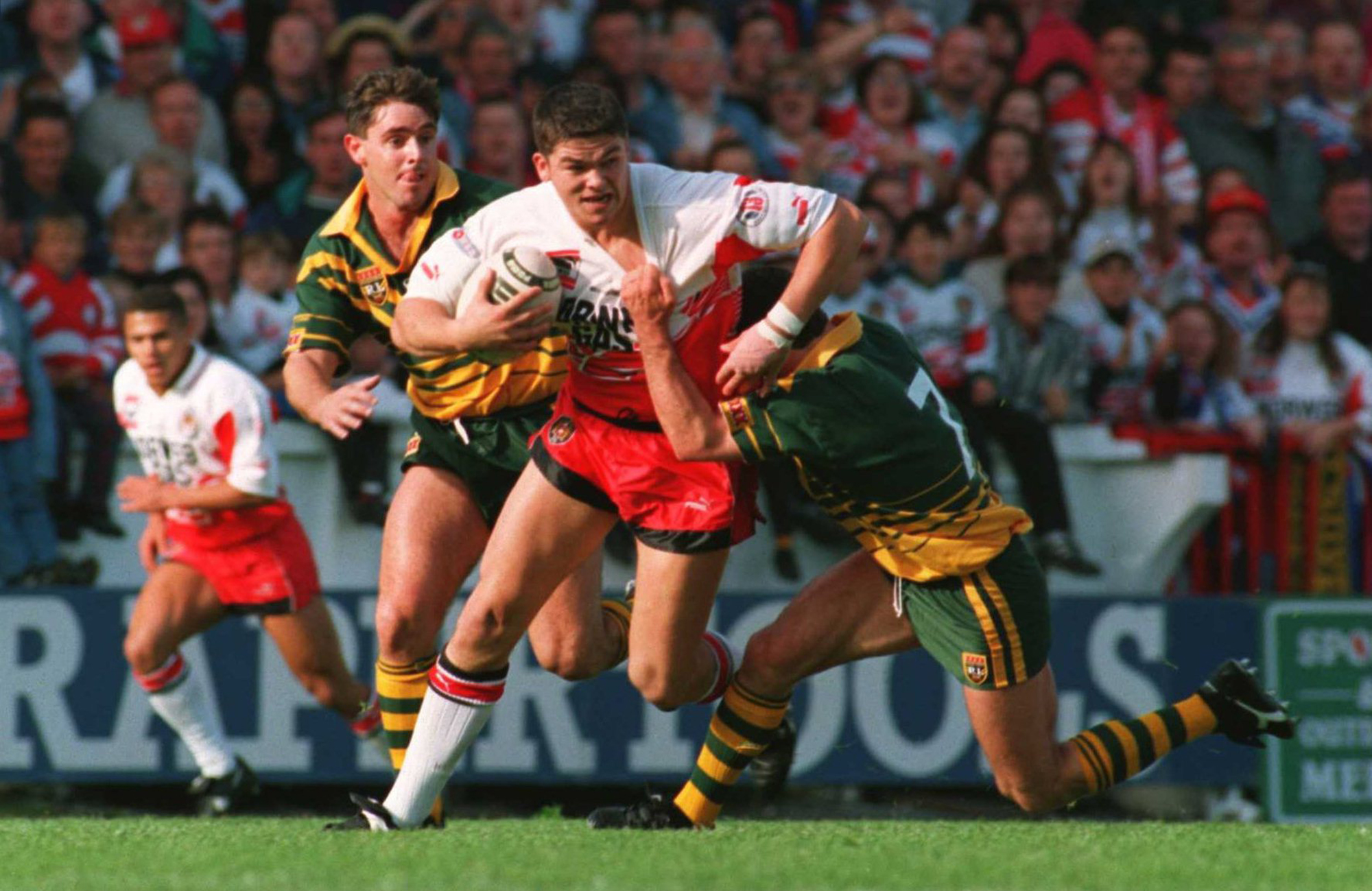 Wigan's Andy Farrell tries to outrun Australia's Ricky Stuart during the 1994 Wigan Tour.