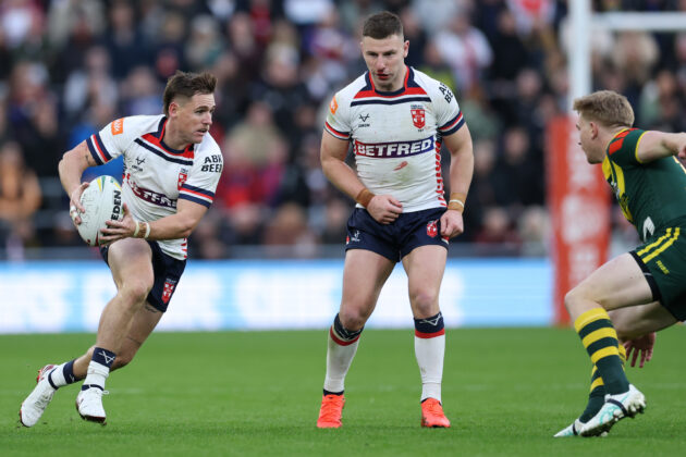 England's AJ Brimson makes a break as George Williams looks on during a November 2026 Rugby League Ashes match against Australia