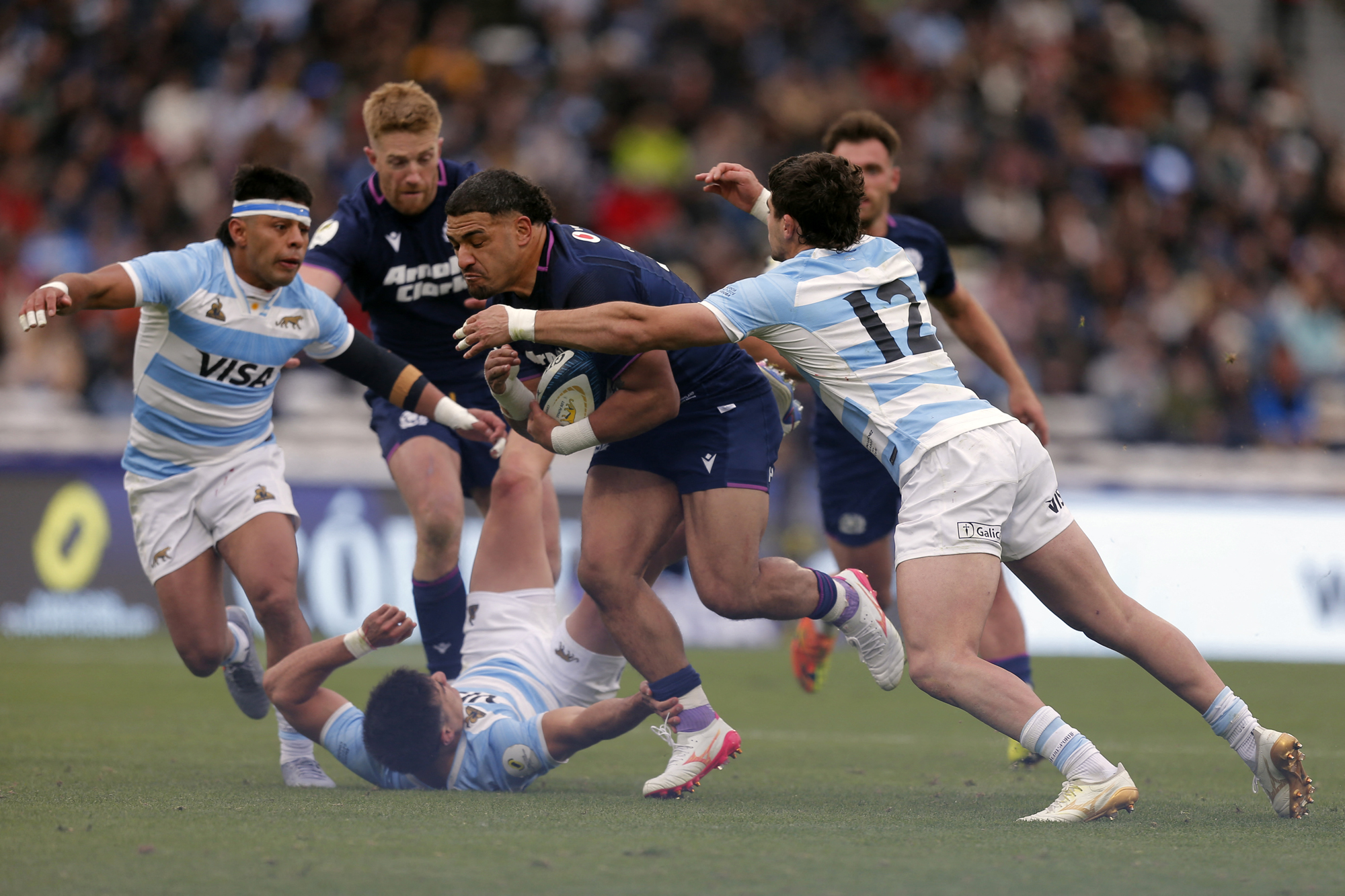 Scotland's Sione Tuipulotu is tackled by Argentina's Tomas Albornoz during the 2026 Nations Championship match