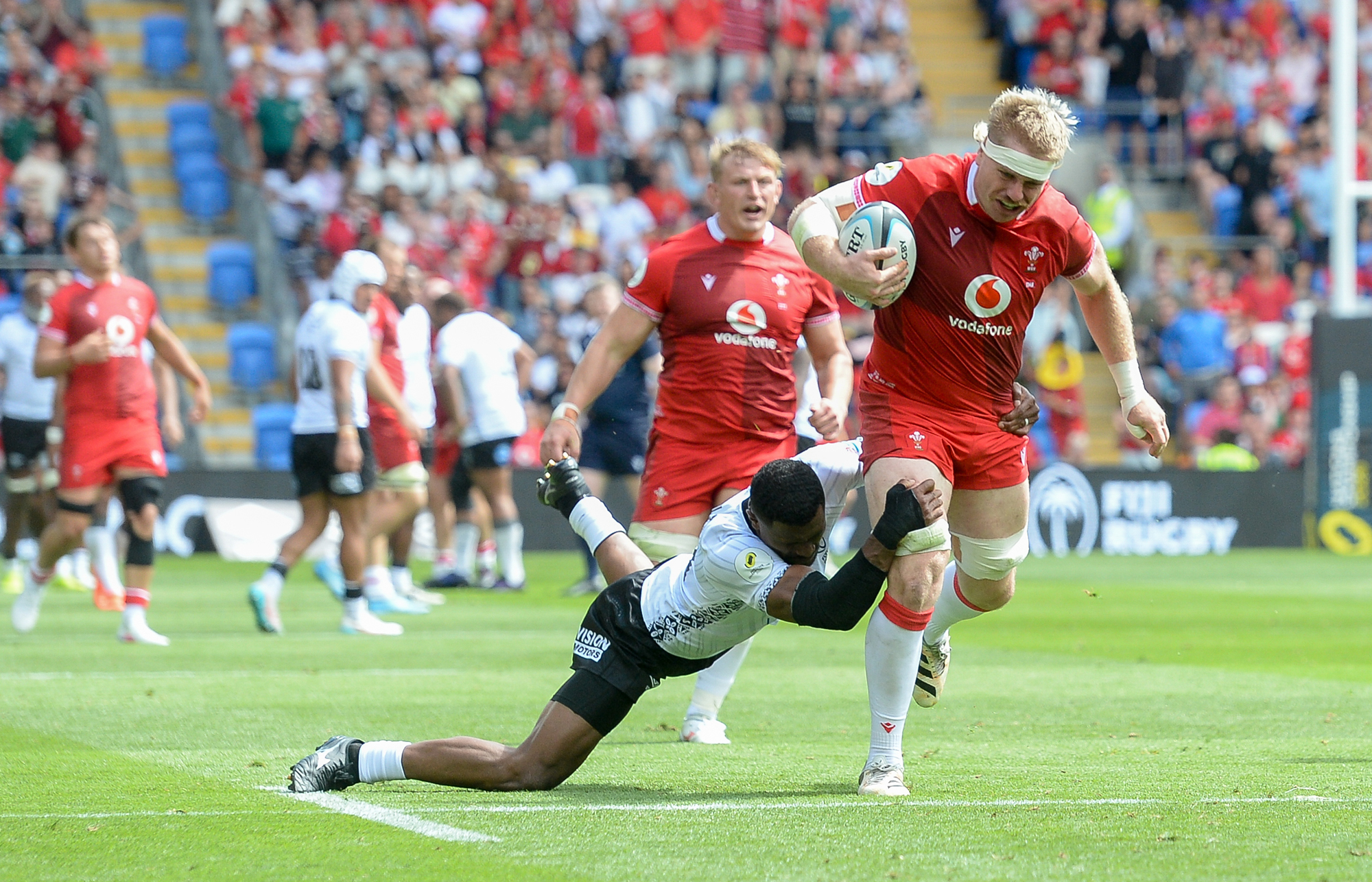 Wales' Aaron Wainwright is tackled by Fiji's Salesi Rayasi during the 2026 Nations Championship match
