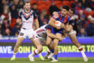 Newcastle Knights' Dylan Brown is tackled during the July 2026 NRL match against the Sydney Roosters