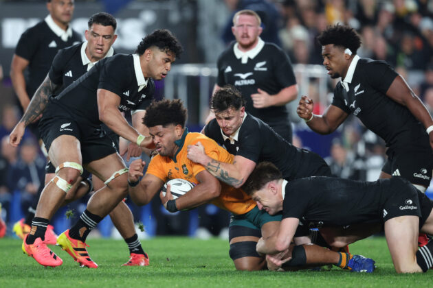 Rob Valetini is tackled by New Zealand players during the season's first 2026 Bledisloe Cup match at Eden Park.