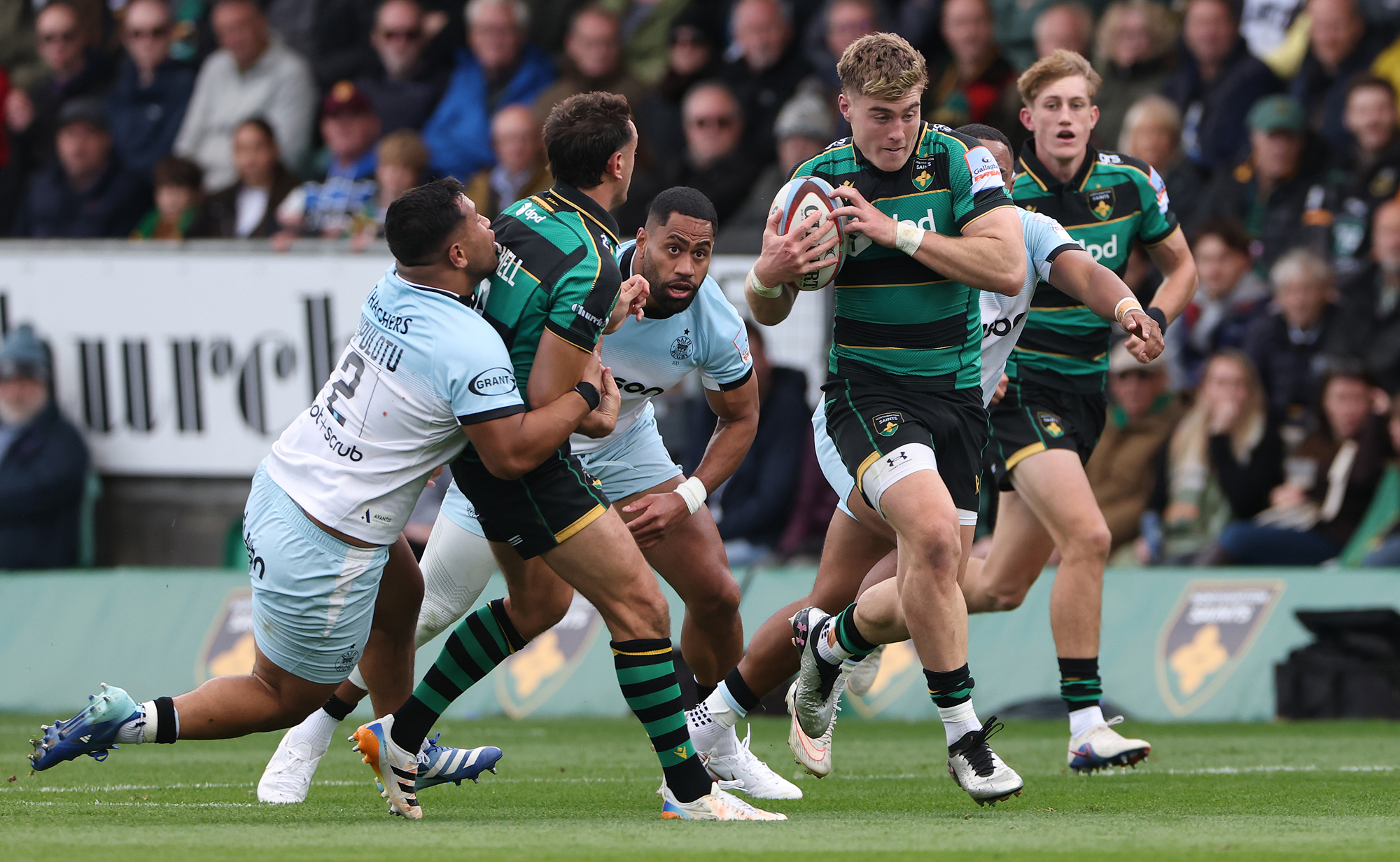 Tommy Freeman of Northampton Saints runs with the ball during the October 2026 PREM Rugby match against Bath.
