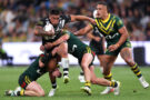New Zealand's Erin Clark is tackled by Australia players during the opening match of the 2026 Rugby League World Cup.