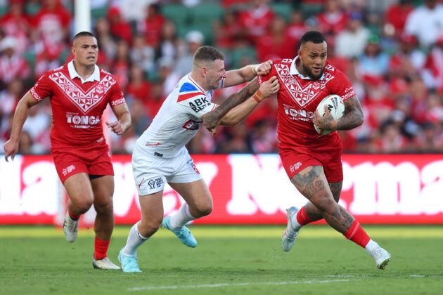 Addin Fonua-Blake of Tonga runs with the ball during the team's opening Rugby League World Cup victory against England