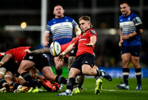 Munster's Craig Casey makes a box kick during the October 2026 URC match against Leinster