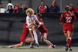 England's Ellie Kildunne is tackled by Canada's Sophie De Goede and Shoshanah Seumanutafa during their third WXV Global Series 2026 encounter