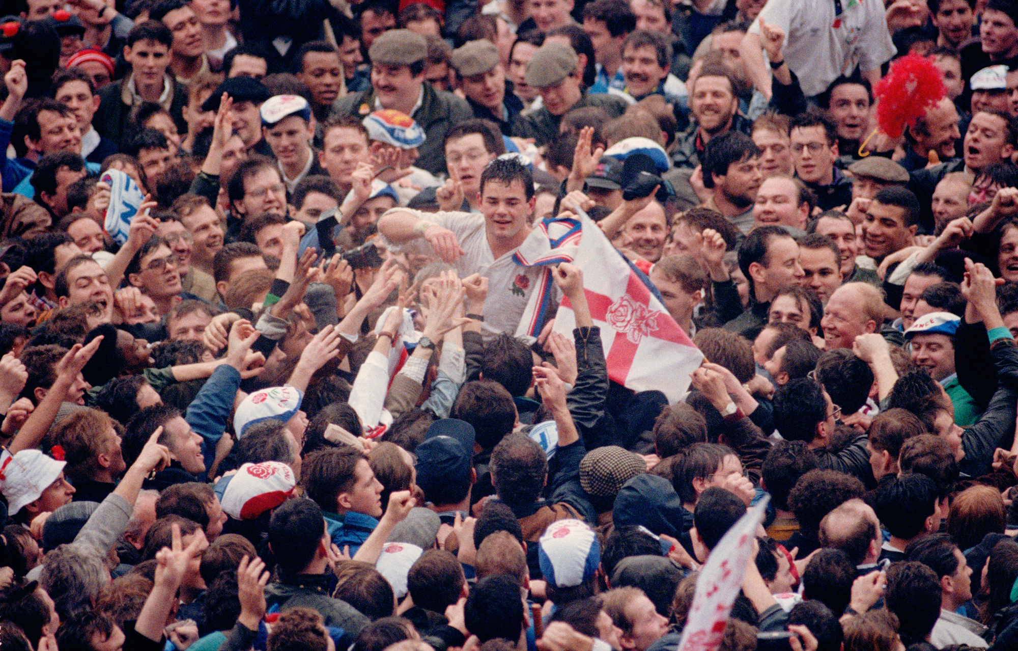 England's Will Carling is embraced by the Twickenham crowd after winning a Five Nations Grand Slam in 1991