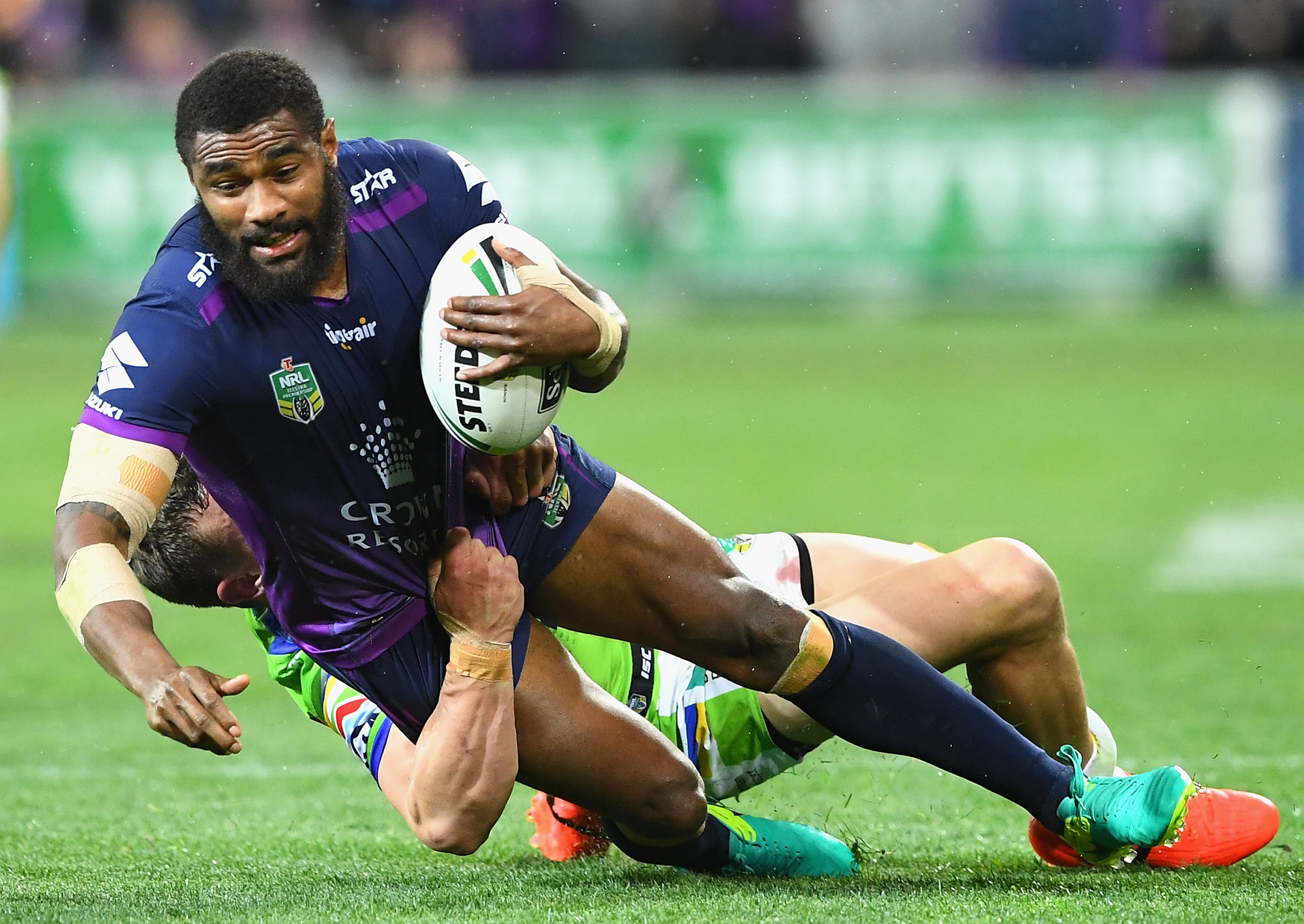 Melbourne Storm's Marika Koroibete breaks the tackle during the 2016 NRL Preliminary Final against the Canberra Raiders